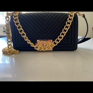 Black and gold bag. Brand: most wanted bought at Marshall’s